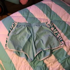 Teal Nike running shorts